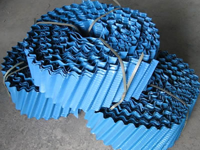There are three rolls of blue cooling tower fills, and they are packaged separately by straps.