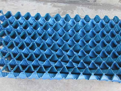 One blue cross fluted fill pack is on the ground, each piece of the fill is placed from opposite direction alternatively.