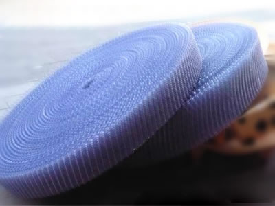 Two rolls of purple cooling tower fills are shown on the picture.